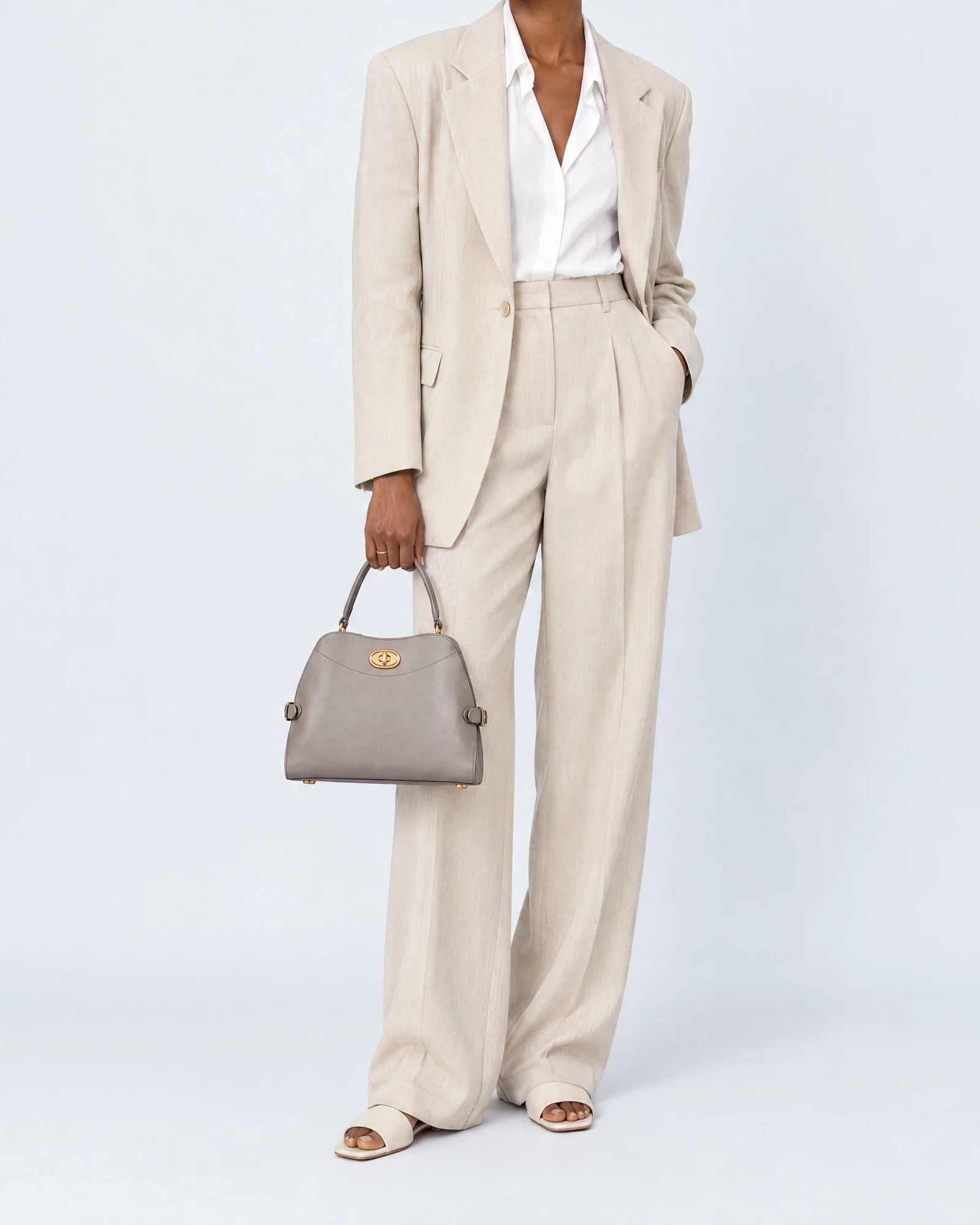Gray Leather Top-Handle Bag, carried by a model